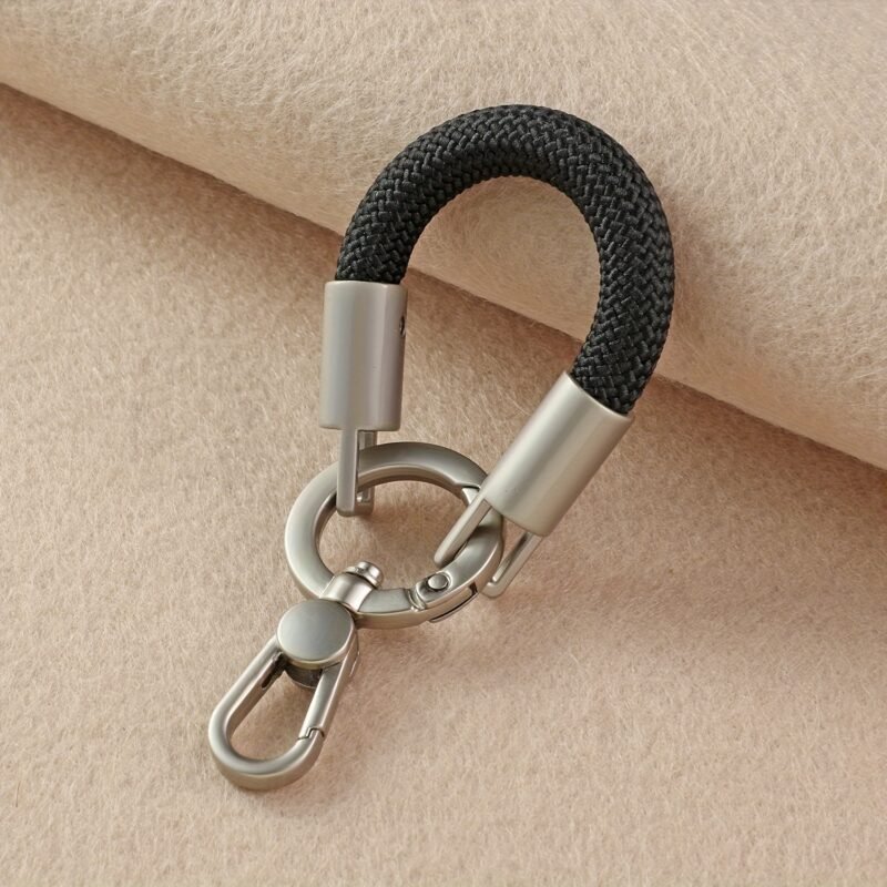 49f8882d-0a04-4f0f-852c-98aa46bc41ca.jpg 1pc 360-degree rotatable finger strap BLACK